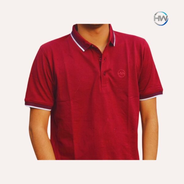 Man wearing a Heaven Wear Classic Fit Polo Shirt for Men in red, made from China PK fabric, standing outdoors with a background of buildings. The polo shirt features a neat collar, short sleeves, and a comfortable fit. Men's maroon polo t shirt in bangladesh.